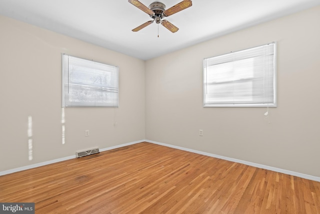 unfurnished room with ceiling fan and light hardwood / wood-style flooring