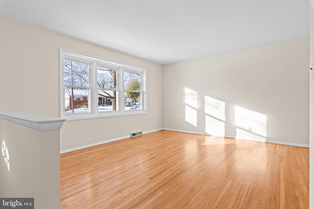 unfurnished living room featuring light wood-type flooring