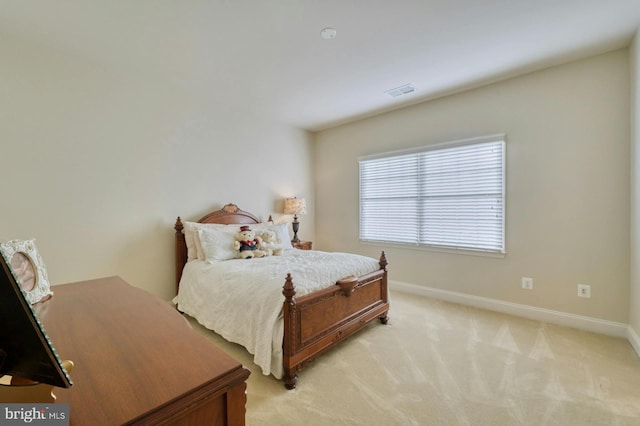 bedroom with light carpet