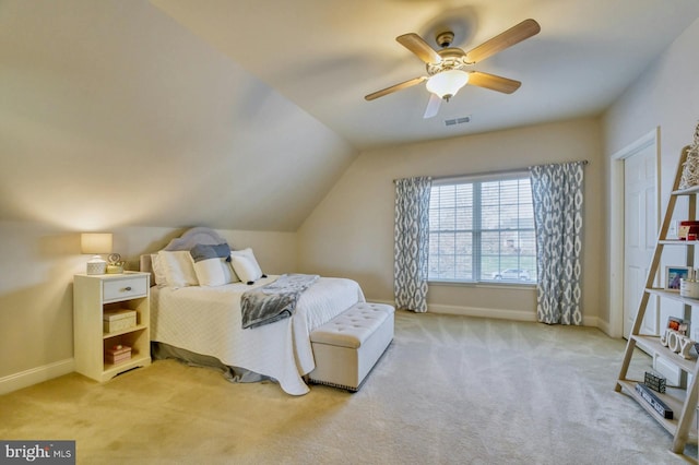 carpeted bedroom featuring ceiling fan and vaulted ceiling