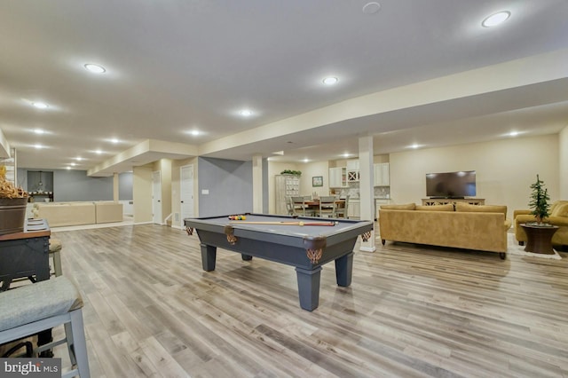 recreation room with light hardwood / wood-style flooring and pool table