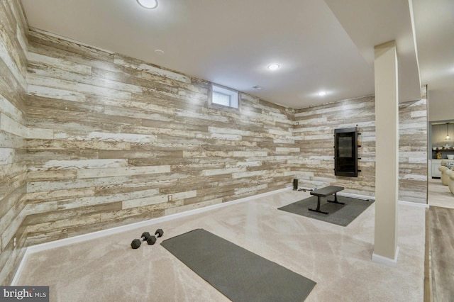 workout room with light colored carpet