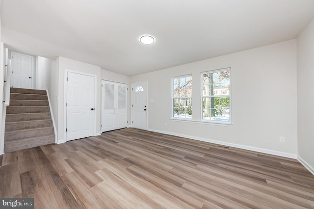 spare room featuring light hardwood / wood-style floors