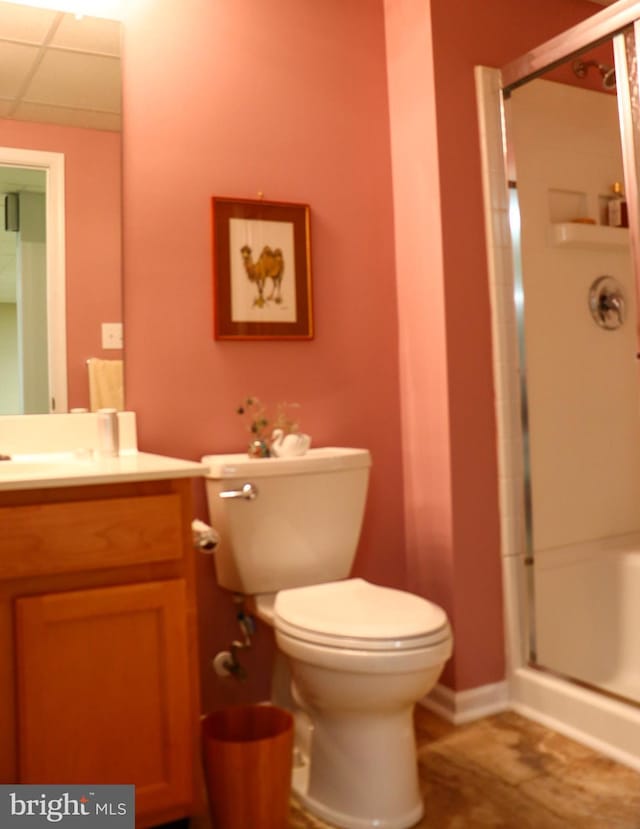 bathroom featuring vanity, toilet, and an enclosed shower