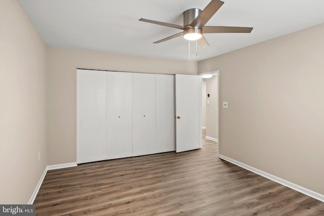 unfurnished bedroom featuring a closet, ceiling fan, and hardwood / wood-style flooring