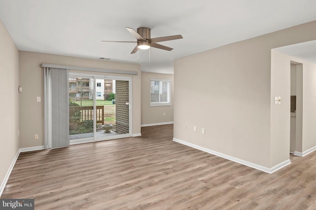 unfurnished room with ceiling fan and light hardwood / wood-style flooring