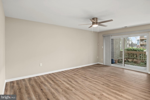 spare room with ceiling fan and light hardwood / wood-style floors