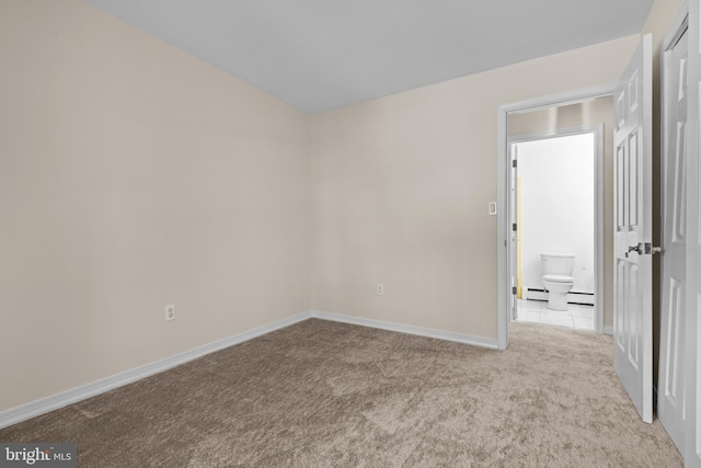 empty room featuring light carpet