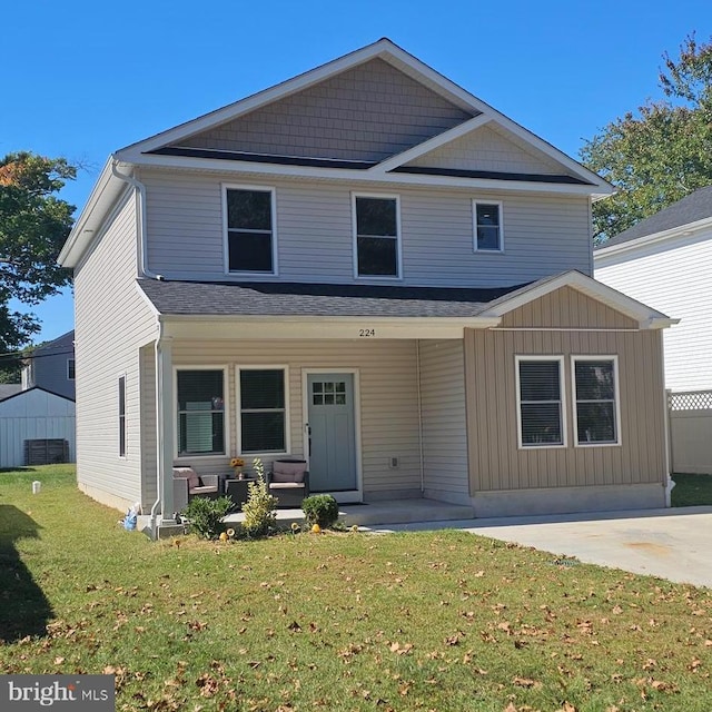 view of front of house with a front lawn and a porch