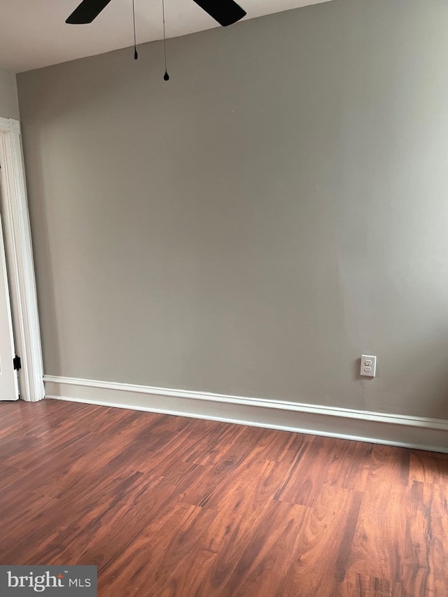 unfurnished room with ceiling fan and hardwood / wood-style floors