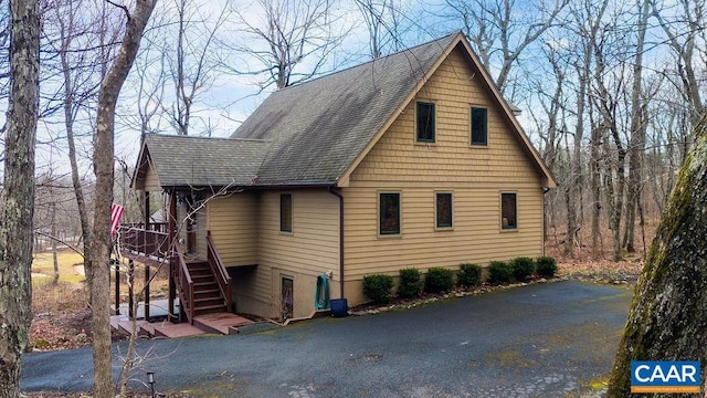 exterior space featuring a wooden deck