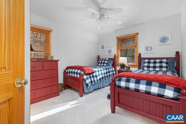 bedroom featuring ceiling fan and light colored carpet