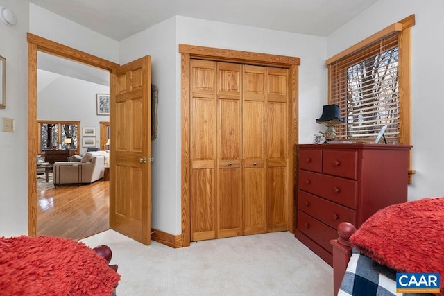 carpeted bedroom with a closet