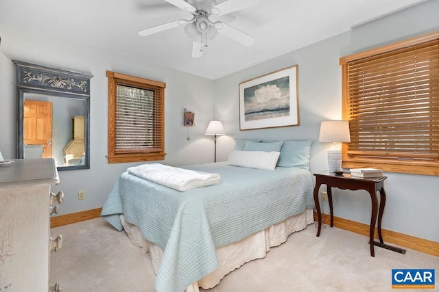 carpeted bedroom featuring ceiling fan