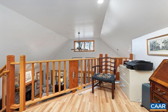 interior space featuring lofted ceiling and light wood-type flooring