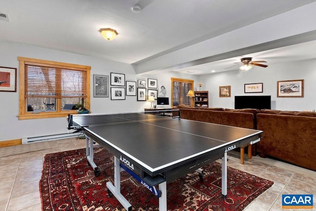 recreation room with light tile patterned floors, a baseboard radiator, and ceiling fan