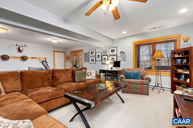 living room with light carpet, a baseboard heating unit, ceiling fan, and beamed ceiling