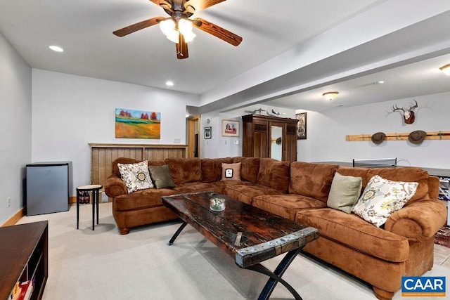 living room featuring ceiling fan and light colored carpet