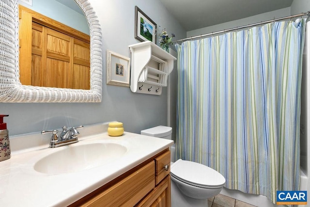 bathroom featuring tile patterned floors, vanity, toilet, and a shower with curtain