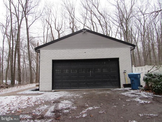 view of snow covered garage