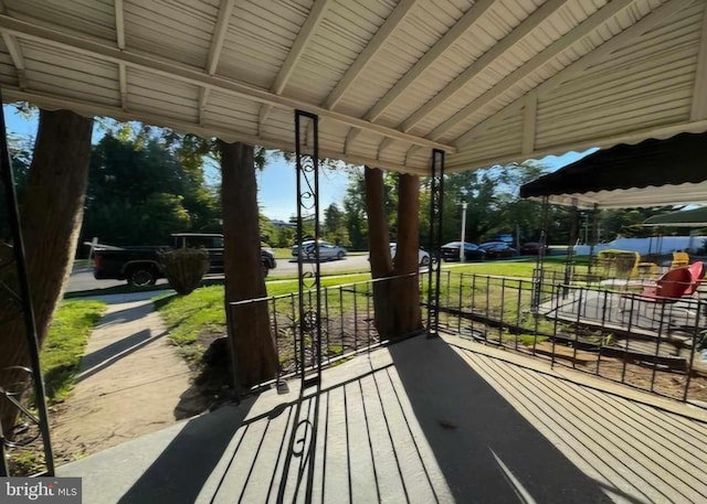 wooden terrace featuring covered porch