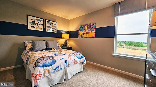 bedroom featuring carpet and multiple windows