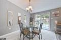 dining space with an inviting chandelier