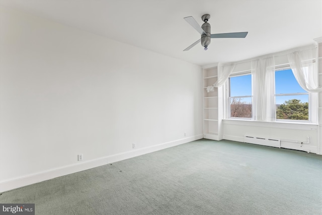 carpeted empty room featuring baseboard heating and ceiling fan