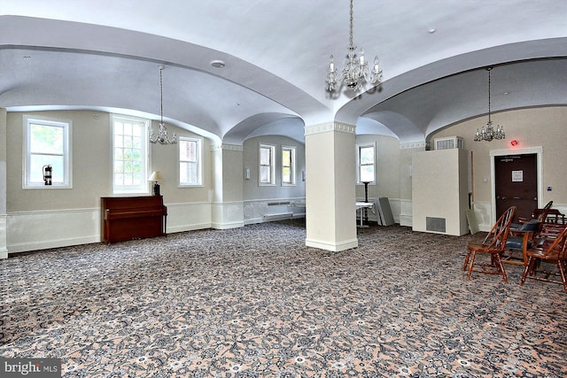 interior space with an inviting chandelier and lofted ceiling