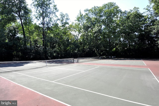 view of tennis court featuring basketball court