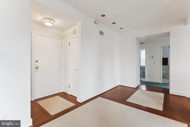 entrance foyer with dark hardwood / wood-style floors