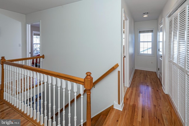 hall with light hardwood / wood-style flooring