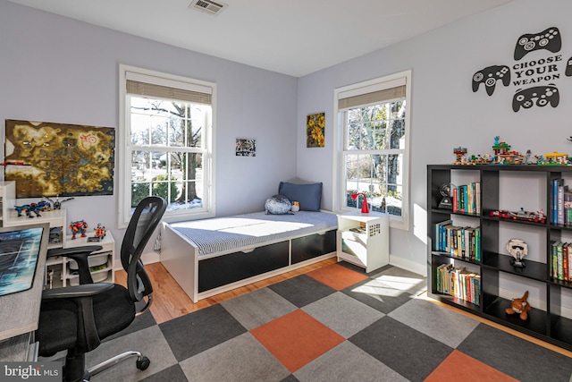 bedroom featuring dark hardwood / wood-style floors