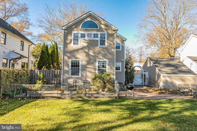 rear view of house with a patio area and a yard