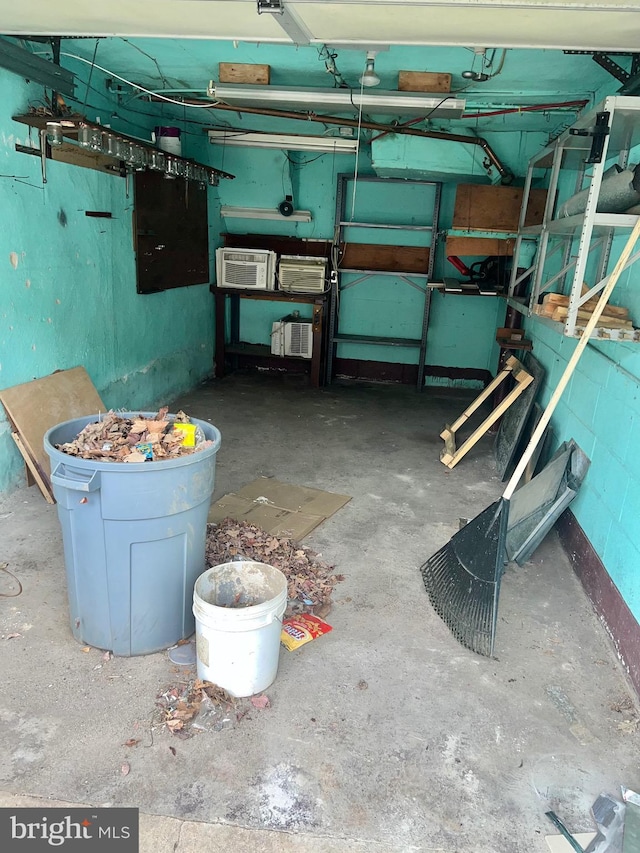 basement with a wall mounted AC