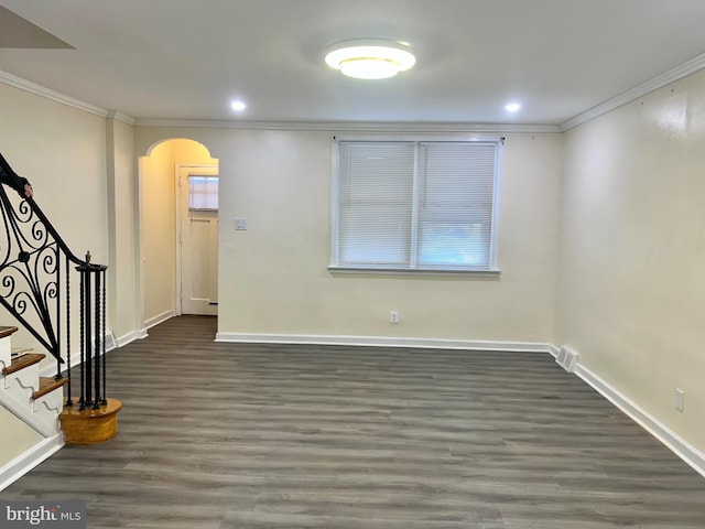 interior space with dark wood-type flooring and ornamental molding