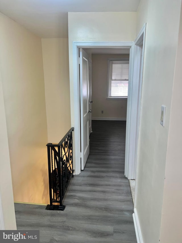 hallway featuring dark hardwood / wood-style floors