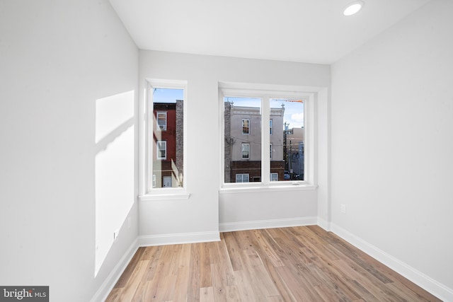 spare room with light wood-type flooring