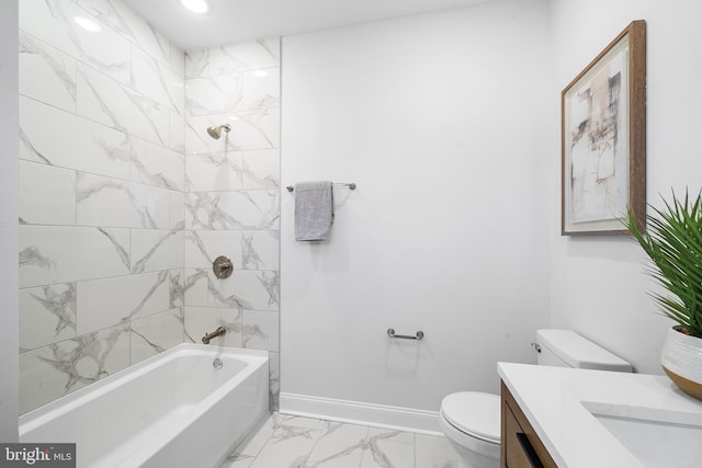 full bathroom with vanity, toilet, and tiled shower / bath