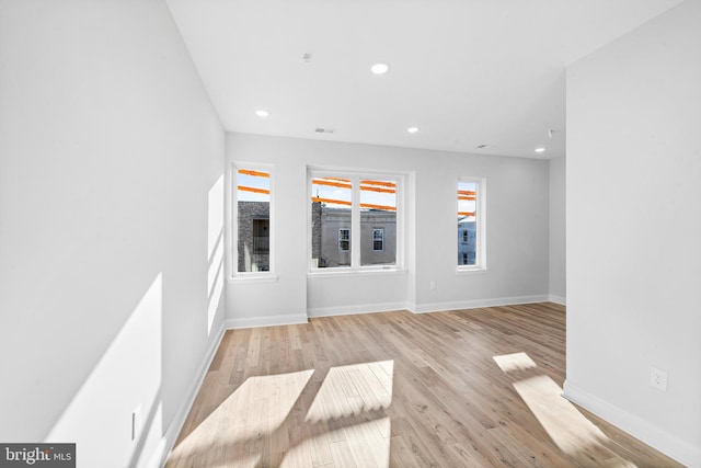 unfurnished room featuring light hardwood / wood-style flooring