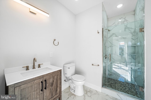 bathroom featuring an enclosed shower, vanity, and toilet