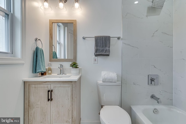 full bathroom featuring vanity, toilet, and tiled shower / bath