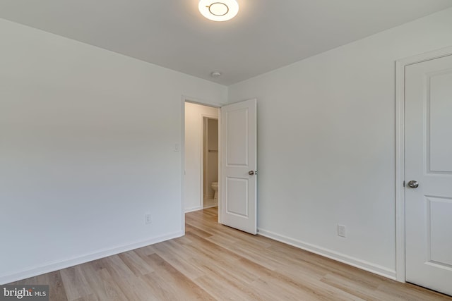 spare room with light hardwood / wood-style flooring