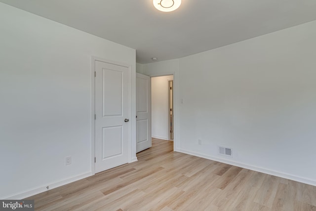 unfurnished room featuring light wood-type flooring