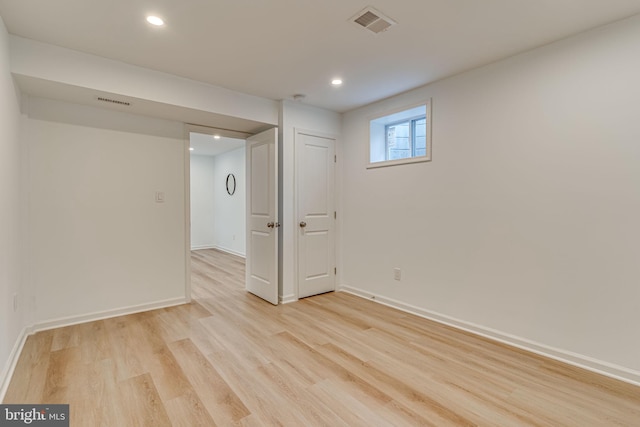 unfurnished room featuring light hardwood / wood-style floors