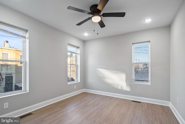 unfurnished room featuring light hardwood / wood-style floors and ceiling fan