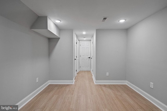 basement featuring light hardwood / wood-style flooring