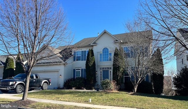 view of front of house featuring a garage and a front yard