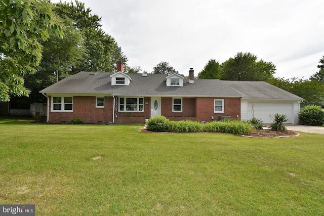 view of front of house with a front yard and a garage