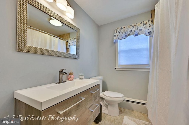 bathroom featuring a baseboard radiator, toilet, and vanity